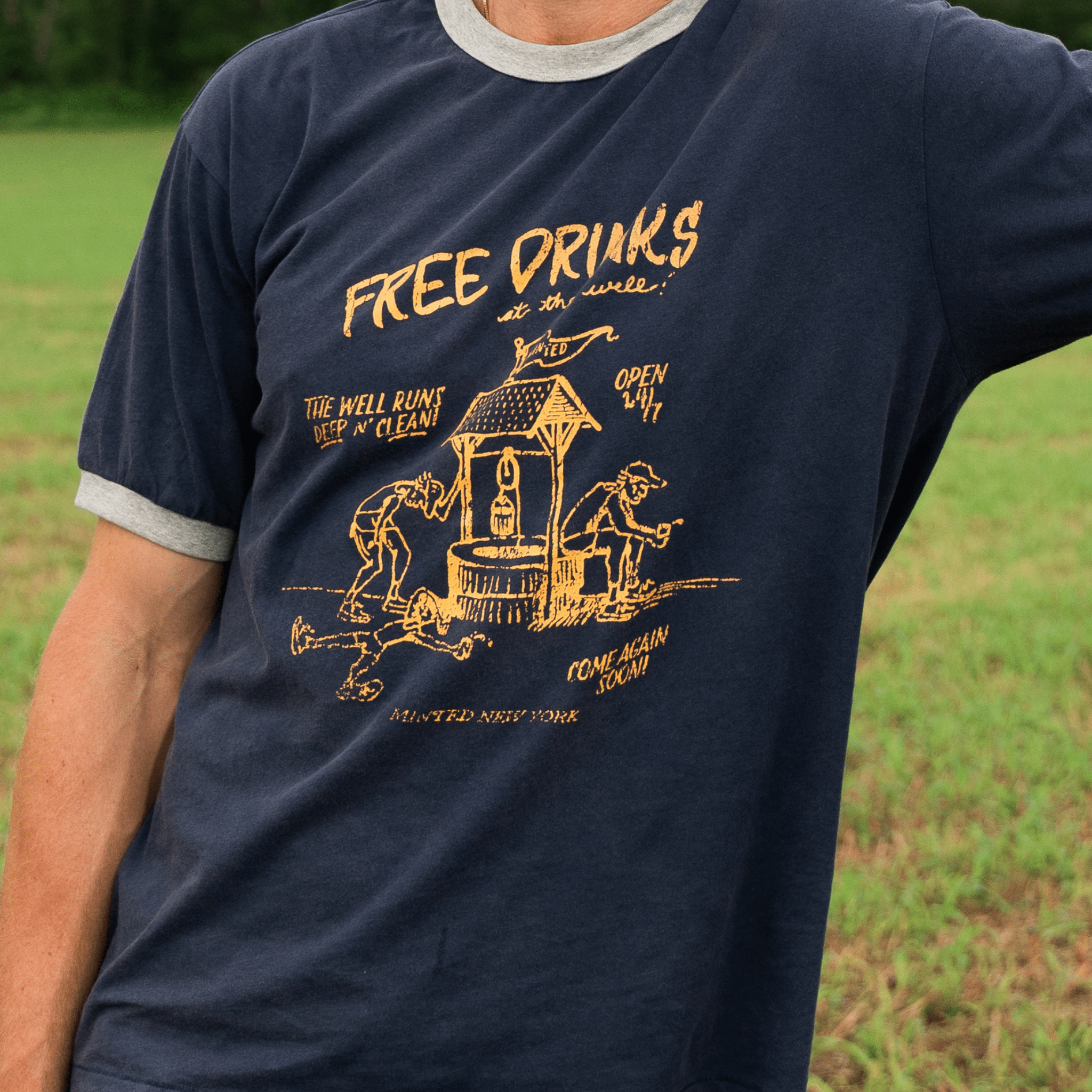 LinoCotton Ringer Tee "Free Drinks at the Well" - Minted New York